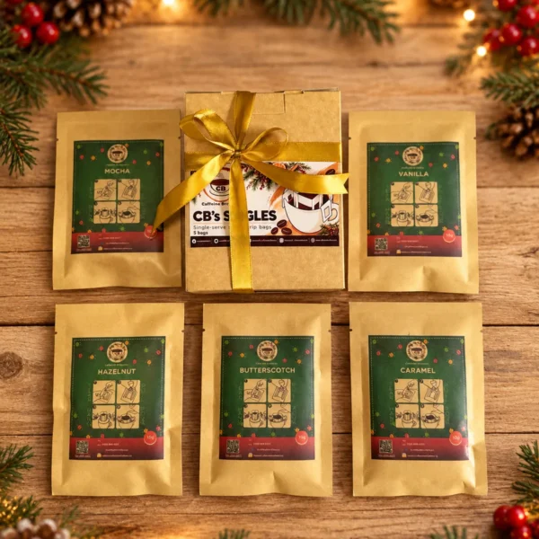 The Christmas Coffee Break gift box and five flavoured drip bags on a Christmas table