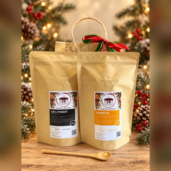 CB’s Finest and Kapeng Barako 400 g pouches with a wooden spoon and abaca gift bag on a Christmas table
