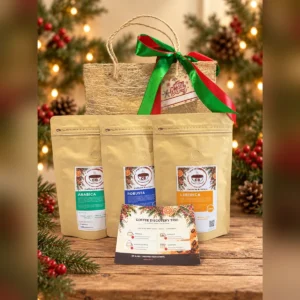 Arabica, Robusta and Kapeng Barako coffee pouches with the Coffee Discovery Trio tasting guide and an abaca gift bag on a Christmas table