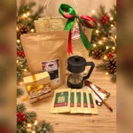 The Holiday Coffee Experience coffee gift set with French press and flavoured drip bags on a Christmas table
