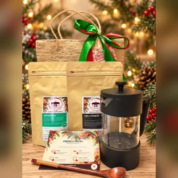The Morning Ritual coffee gift set with French press, Arabica and CB’s Finest coffee in an abaca gift bag on a Christmas table