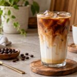 Iced and hot Spanish latte drinks on a home coffee counter